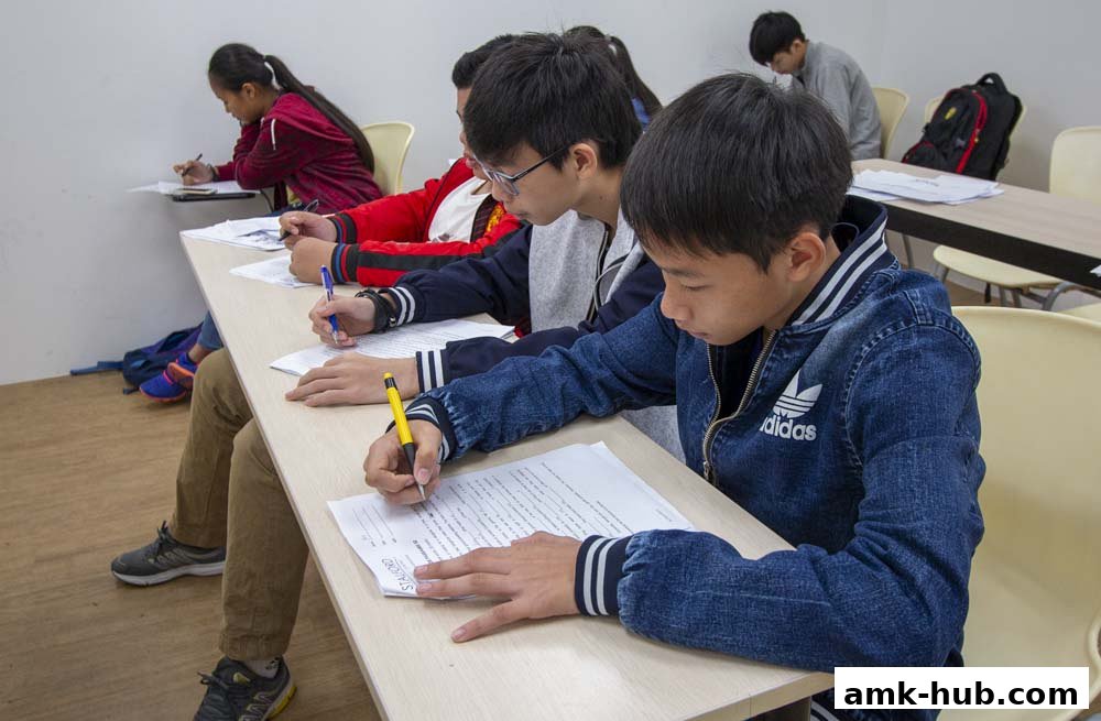 Students focused on writing during a class at Stalford Learning Centre.