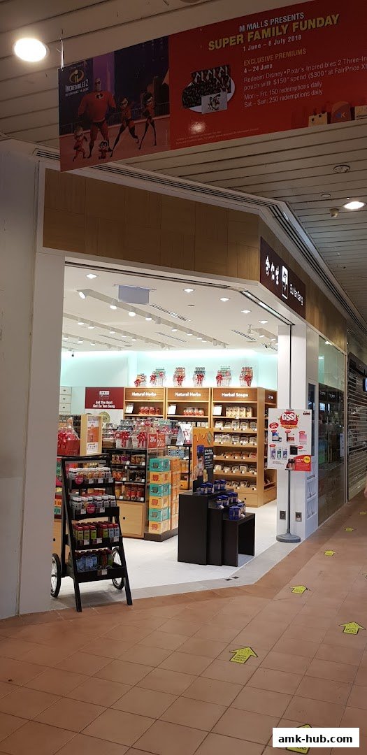 The entrance of Eu Yan Sang shop, showcasing shelves stocked with various health products and a promotional banner.