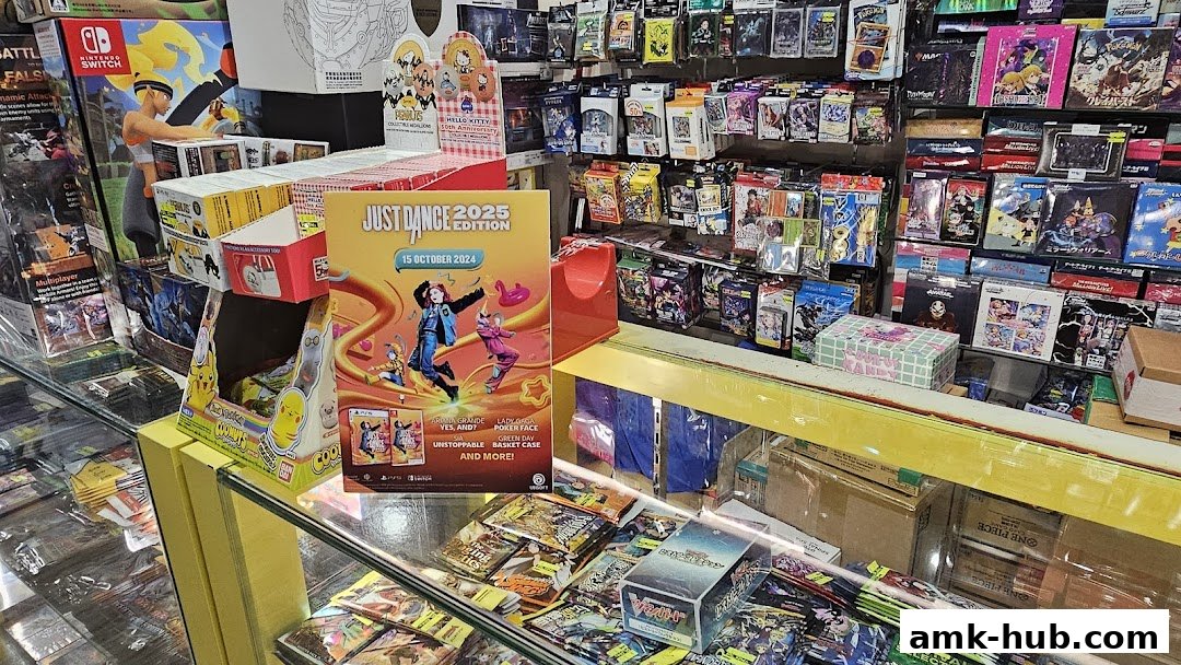 A retail shop interior displaying various video games, trading cards, and collectibles.