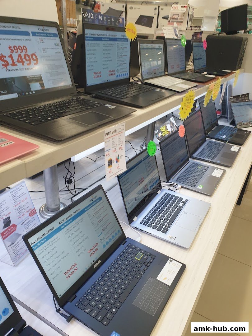 A display of various laptops for sale at Challenger Ang Mo Kio Hub.