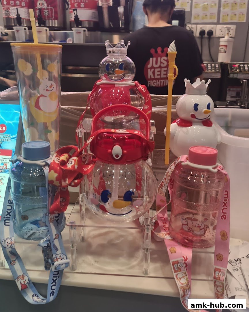 Cute snow-themed drinkware and merchandise displayed at a MIXUE store.