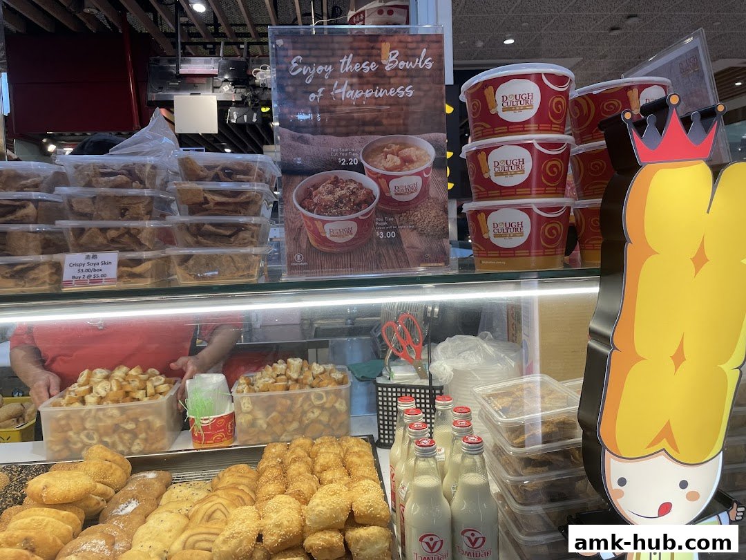 A display of various baked goods and bottled drinks at Dough Culture.