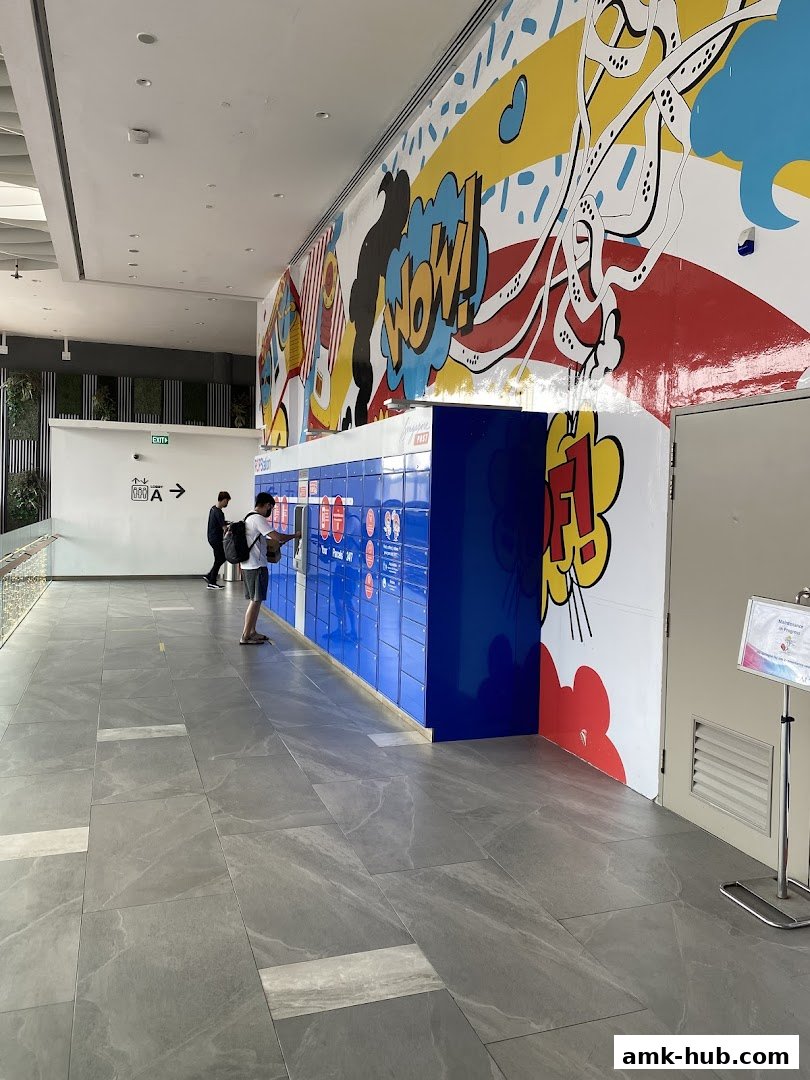 POPStation AMK Hub with colorful comic-style mural and blue parcel lockers.