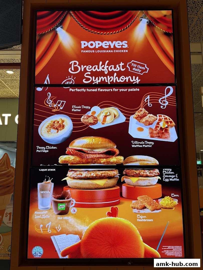 A Popeyes menu board showcasing their breakfast offerings with vibrant food photography.