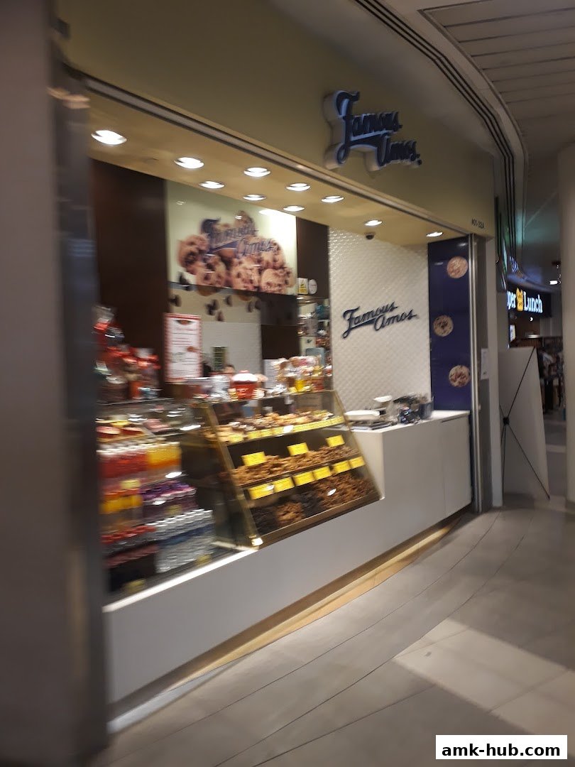 Famous Amos cookie shop with a display of cookies and treats.