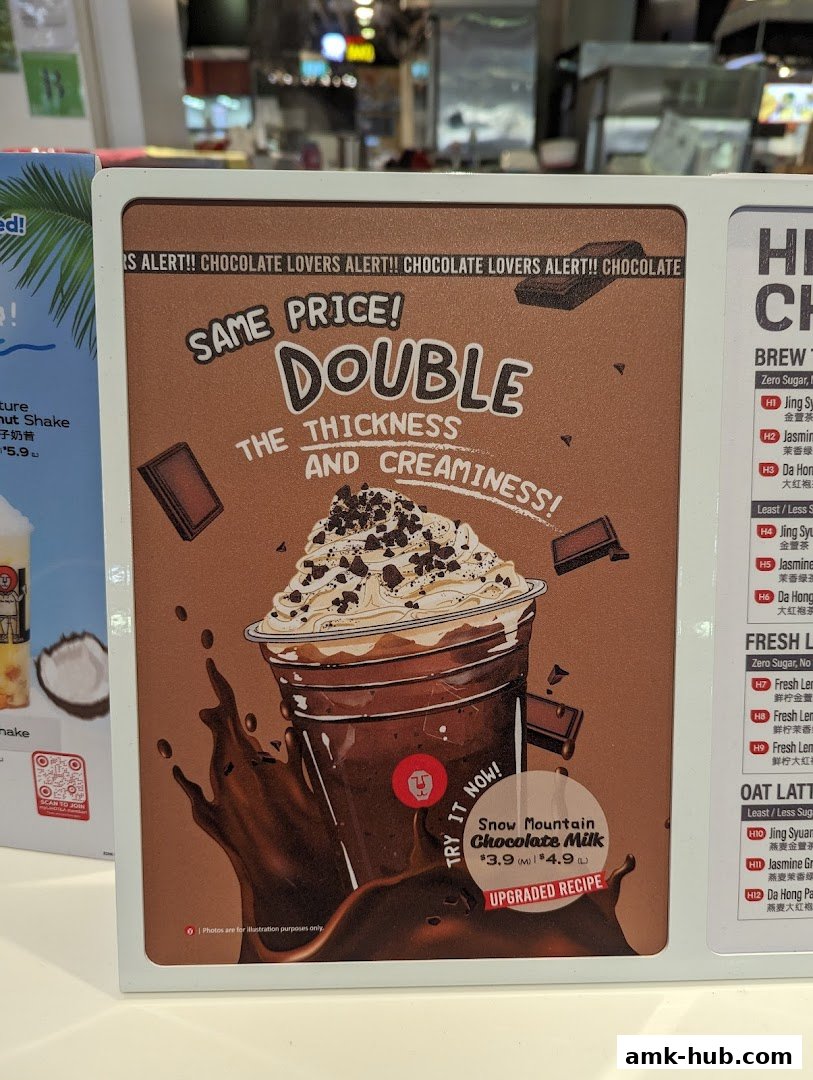 A promotional sign for LiHO TEA's Snow Mountain Chocolate Milk, highlighting its double thickness and creaminess.