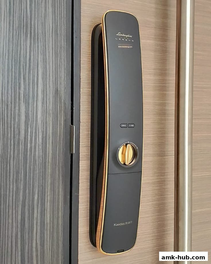 A sleek, modern digital door lock with a Lamborghini Legend branding and gold accents.