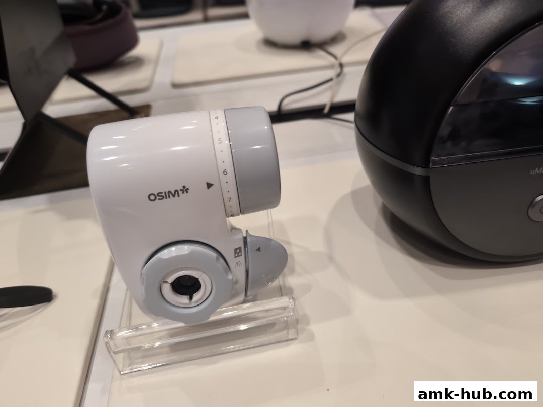 Close-up of an OSIM massage device with adjustable settings.