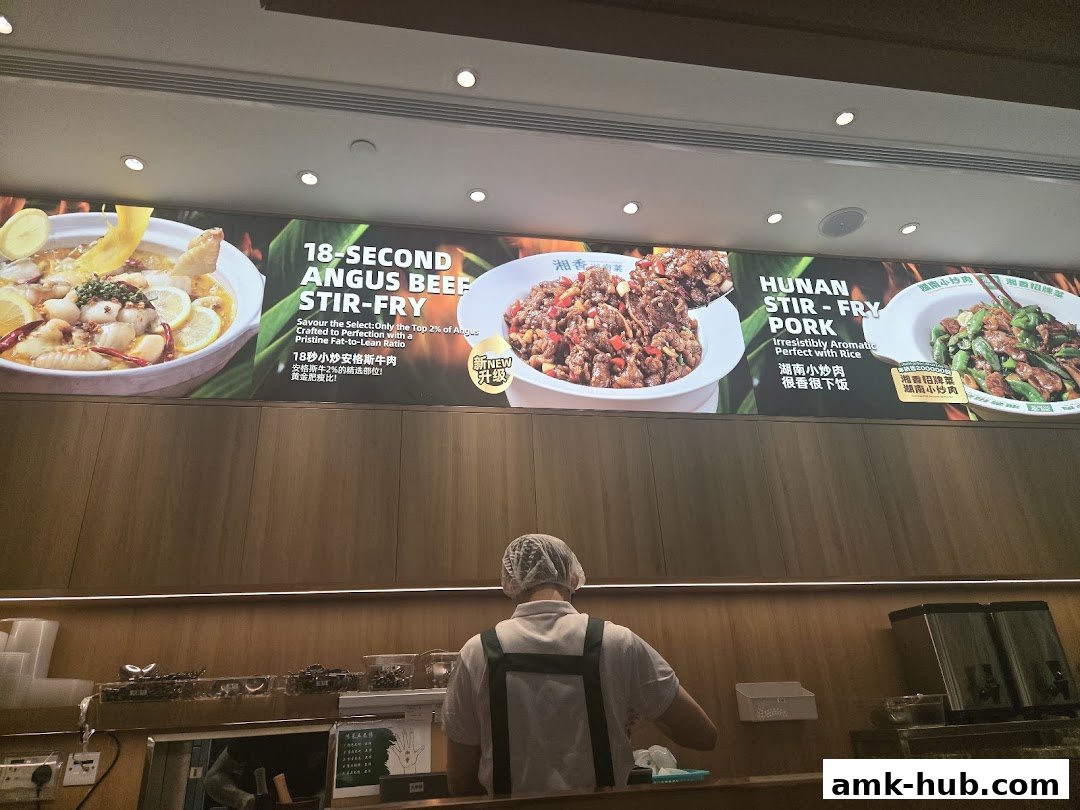 A restaurant display showcasing three popular Hunan cuisine dishes with descriptive text.