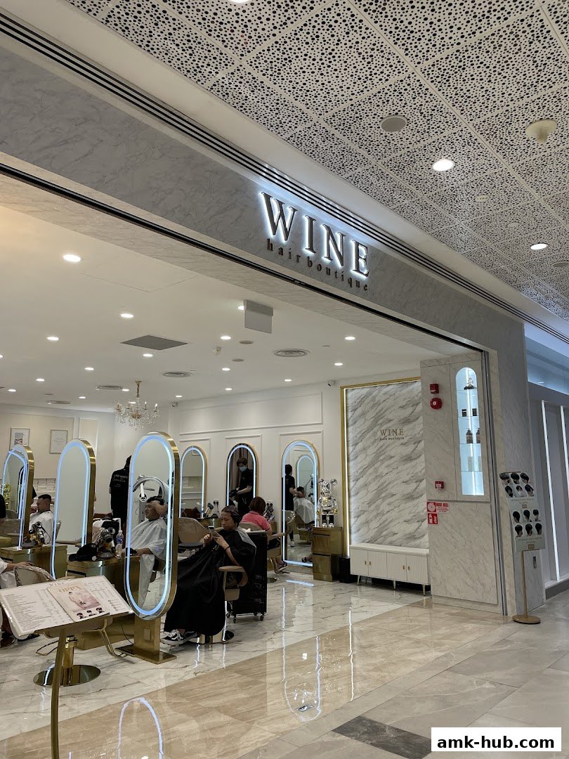 Interior view of Wine Hair Boutique with clients getting their hair styled.