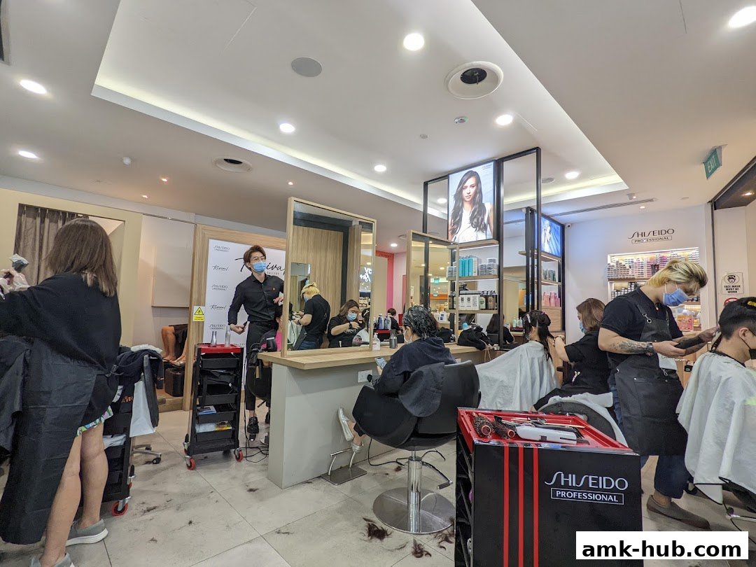 Hairdressers working on clients inside a modern salon with Shiseido Professional branding.