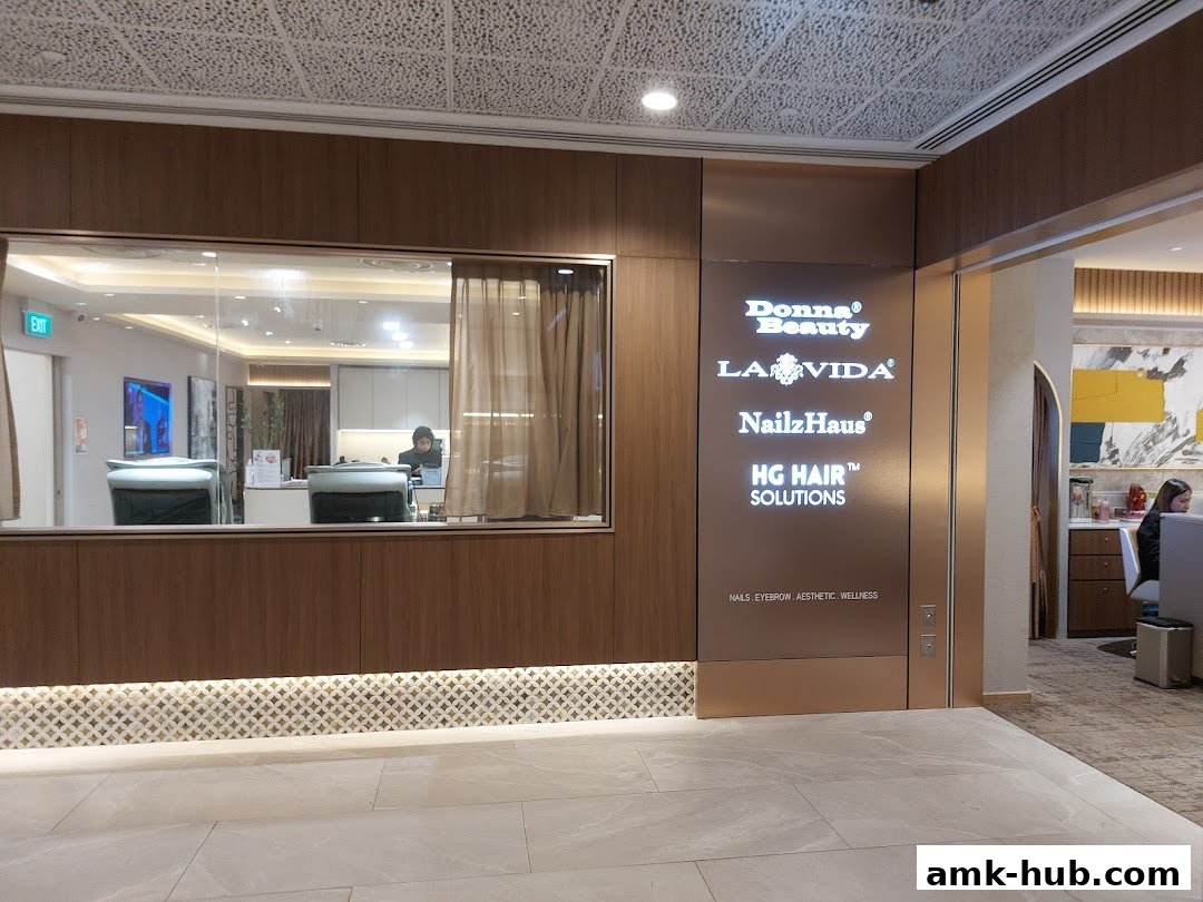 The entrance to Donna Beauty, featuring multiple beauty service brands and a clean, modern interior.