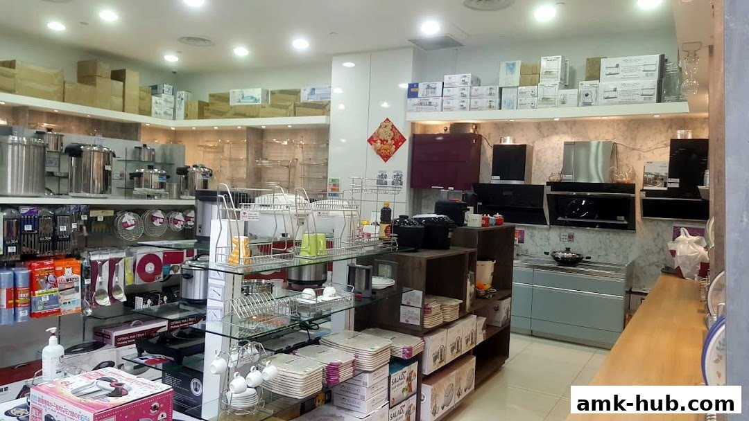 Interior view of a kitchenware store showcasing various appliances and cookware.