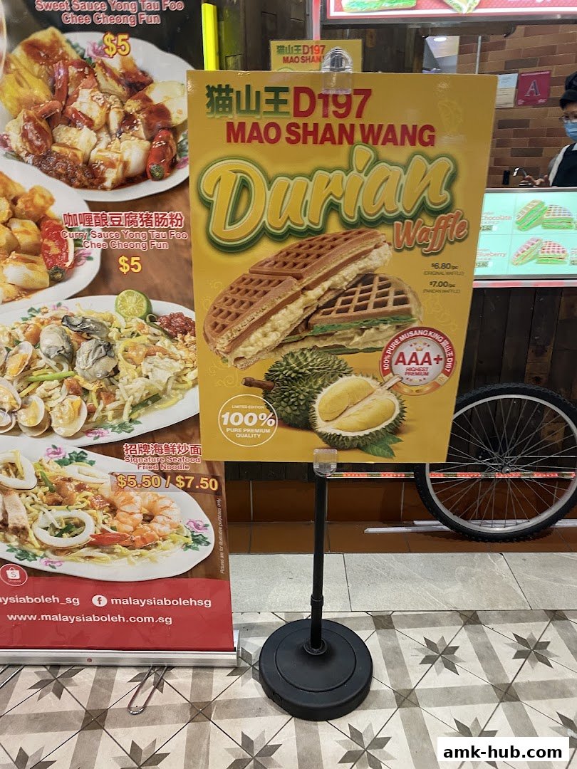 A promotional poster for Mao Shan Wang Durian Waffles and other Malaysian dishes.
