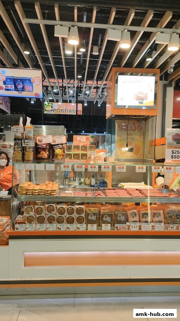 A display of various bakkwa products and snacks at a retail shop.