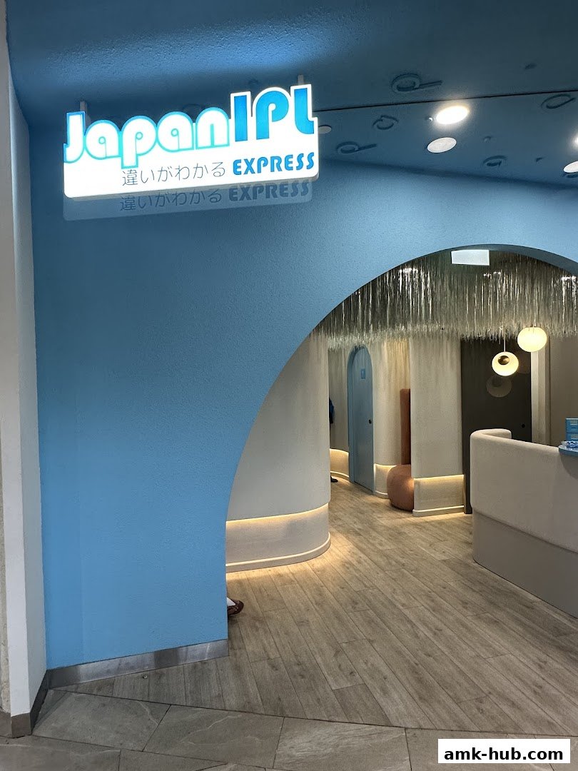 The entrance to Japan IPL Express, featuring a bright blue archway and illuminated signage.
