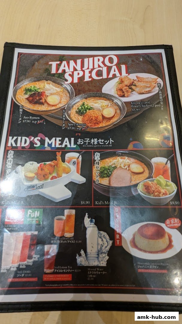 A menu featuring Japanese ramen, kid's meals, and desserts with prices.