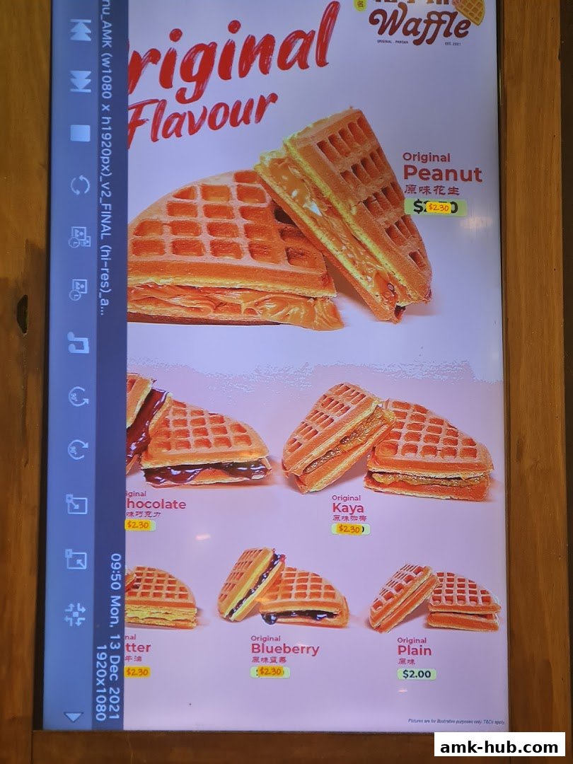 A menu display showcasing various waffle flavors with prices.