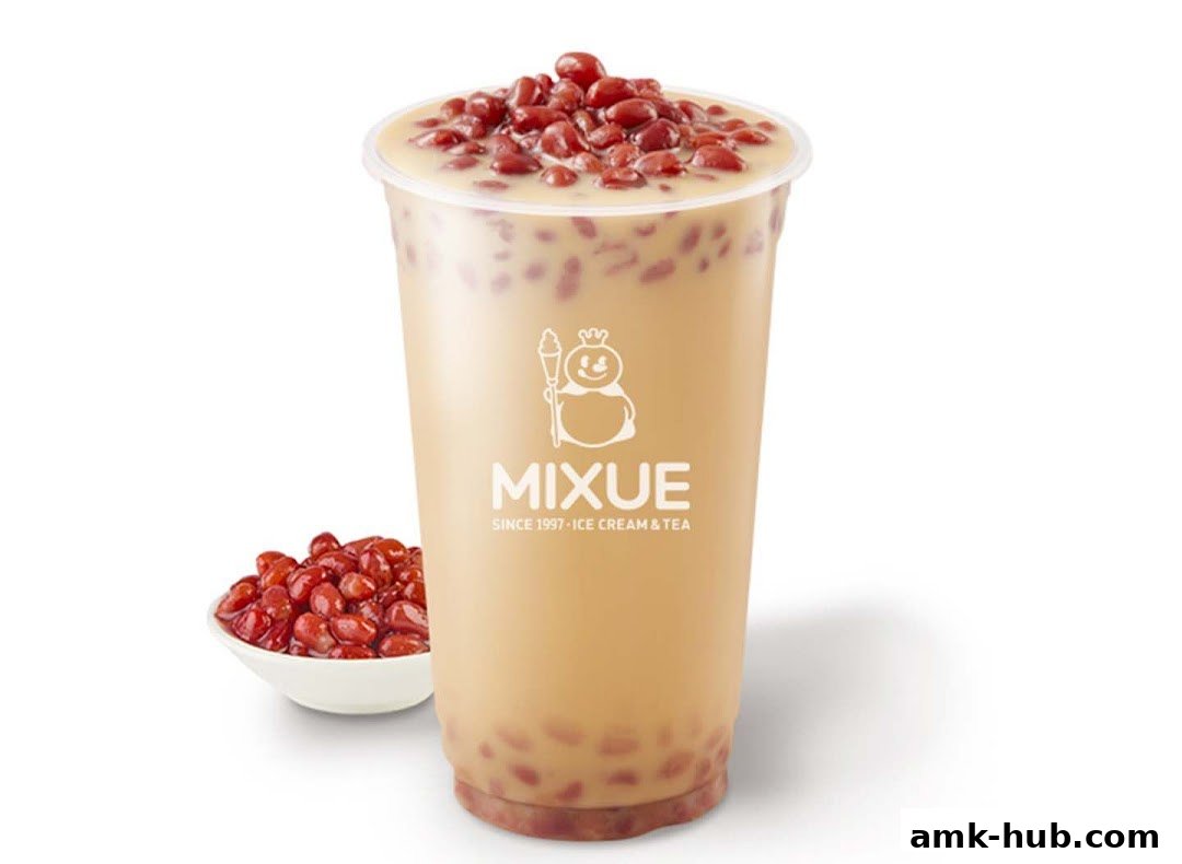 A cup of MIXUE ice cream and tea with red beans and a side of red beans.