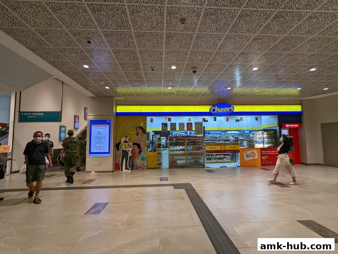 The Cheers convenience store is brightly lit with a yellow and blue facade, offering various products.