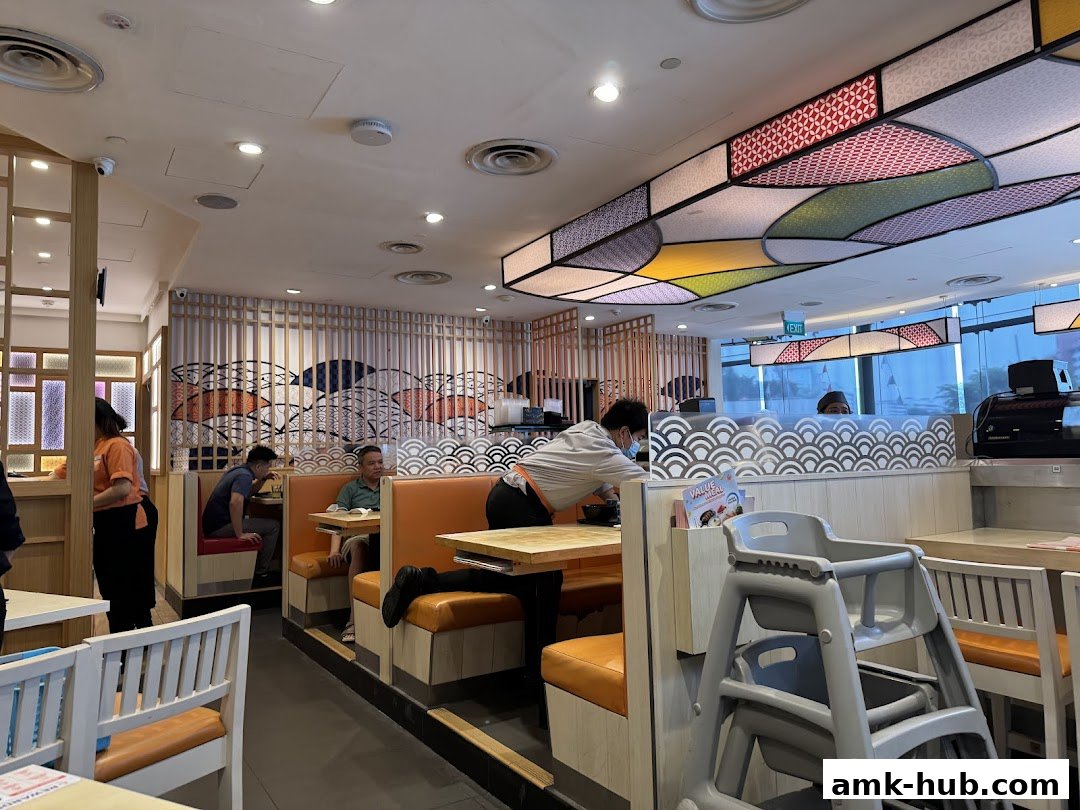 Interior view of Ichiban Sushi Ang Mo Kio with diners and staff.