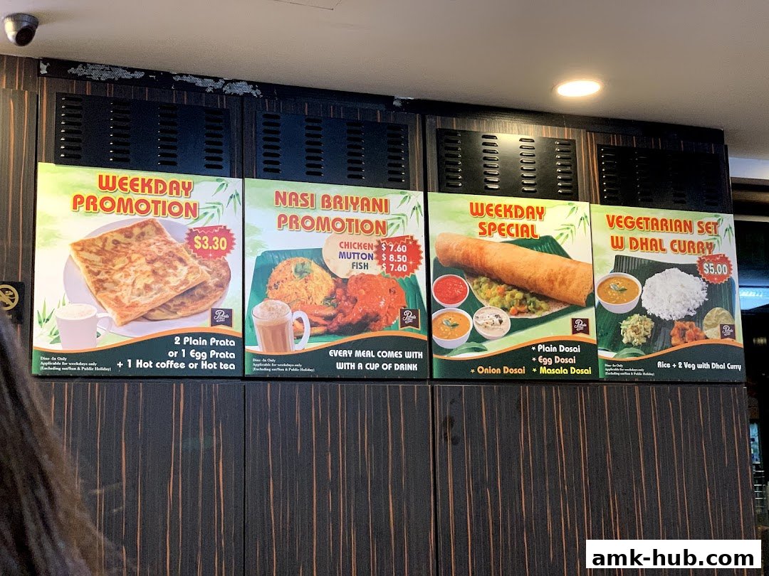 A menu board displaying various promotions and specials for Indian cuisine.