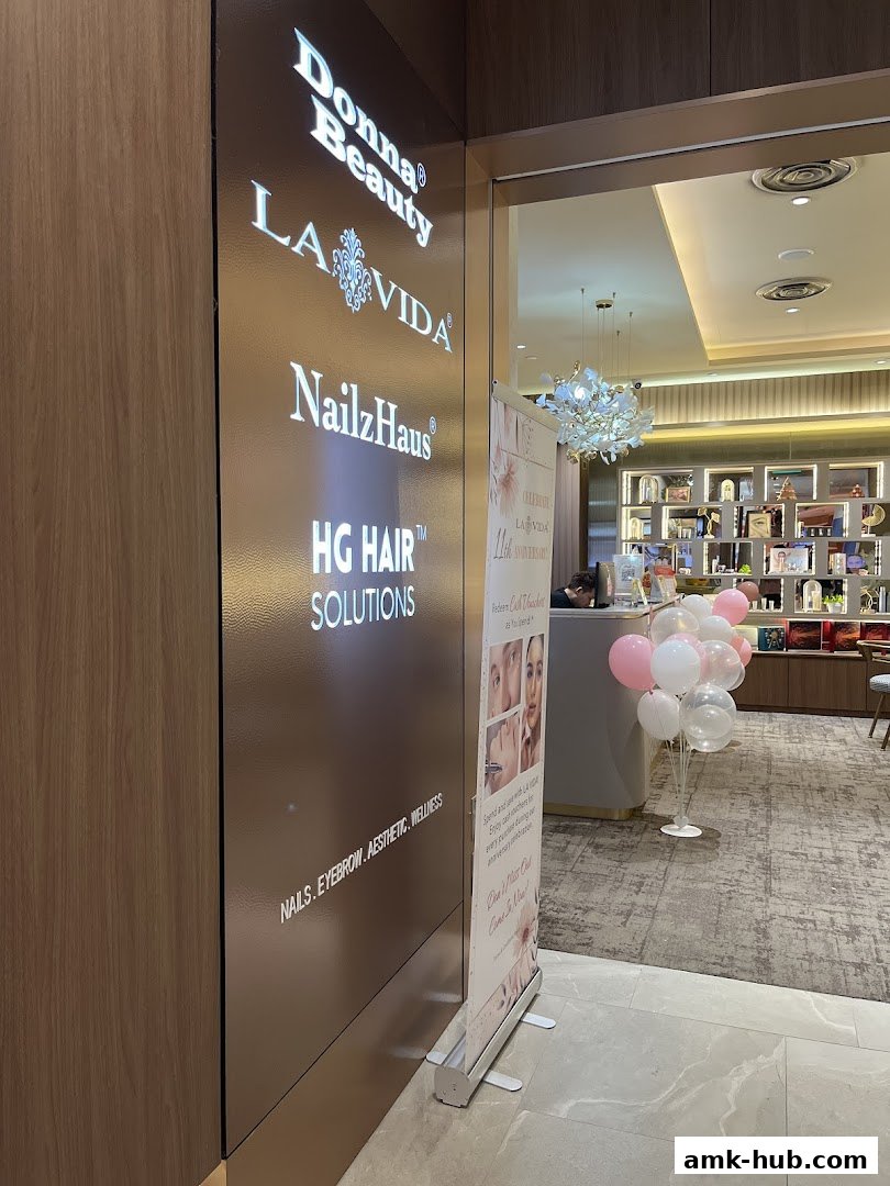 The entrance to Donna Beauty, showcasing multiple beauty service brands and a promotional banner.