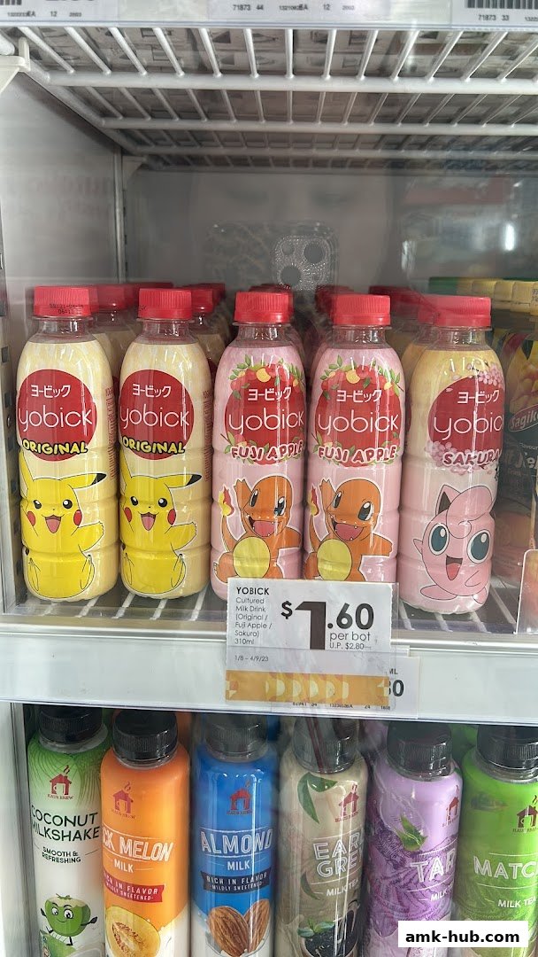 Bottles of Yobick cultured milk drinks with Pokemon characters and other milk drinks in a refrigerator.