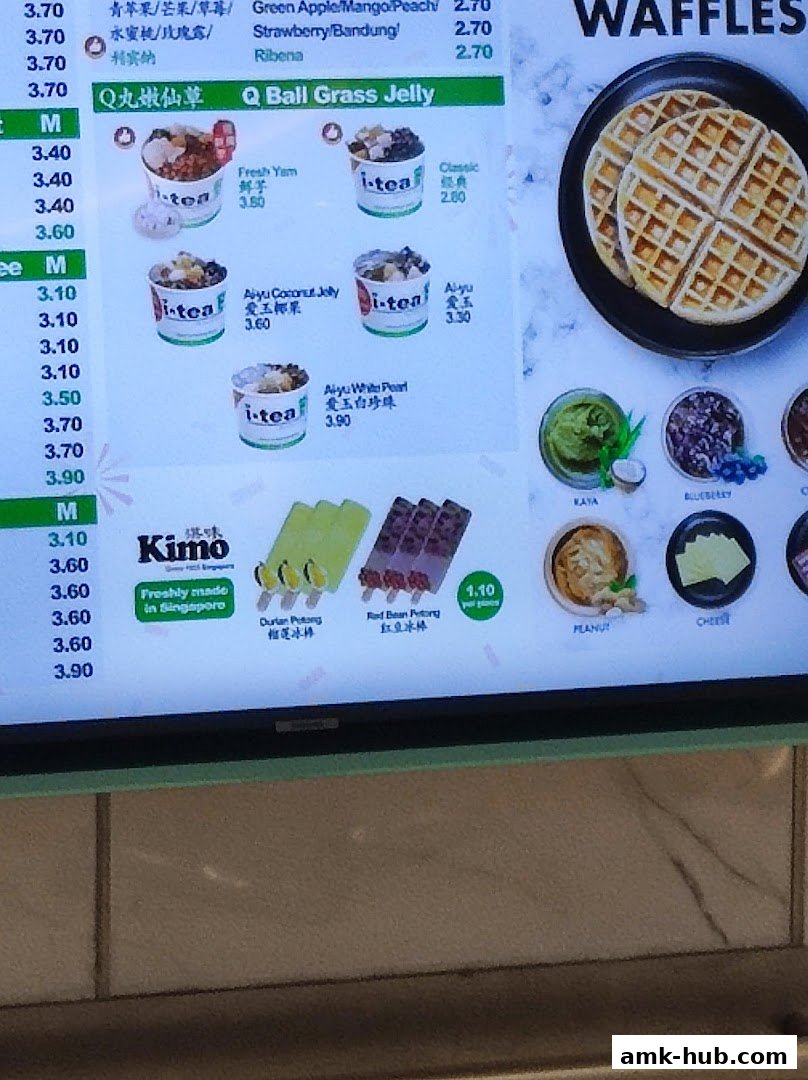 A digital menu board displaying various drinks, desserts, and waffles from iTEA.