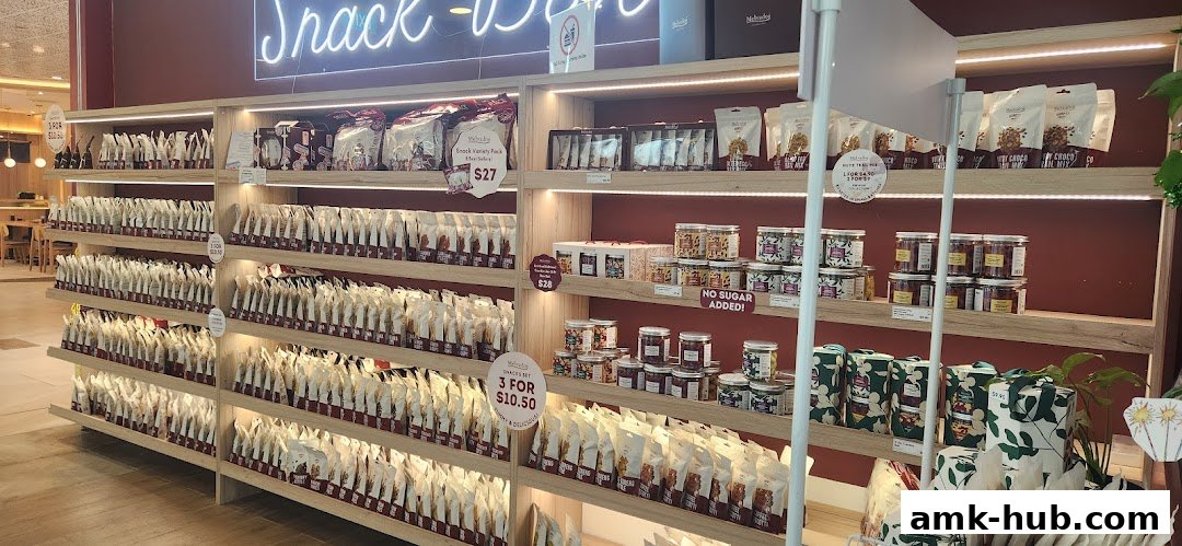 A well-stocked snack shop with shelves full of packaged snacks and jars of treats.