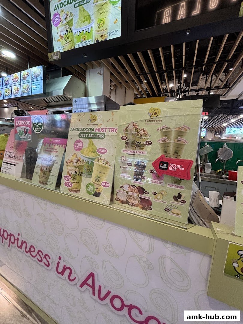 A display of avocado-based desserts and drinks at a shop counter.