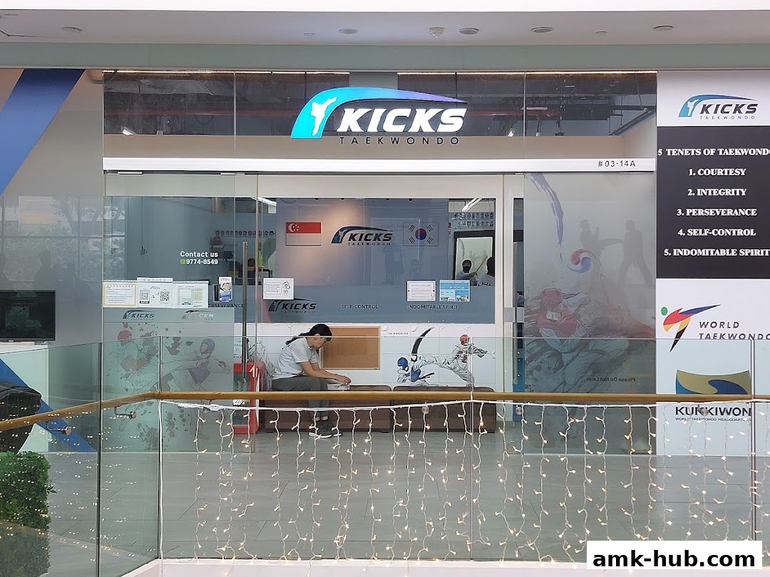 The entrance of Kicks Taekwondo AMK Hub with its logo and taekwondo-themed decor.