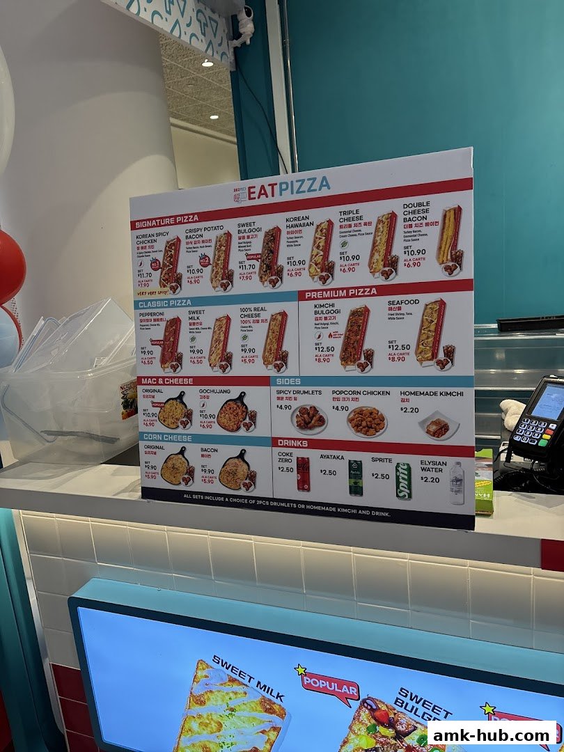 A menu board for Eat Pizza displaying various signature, classic, and premium pizzas, sides, and drinks.