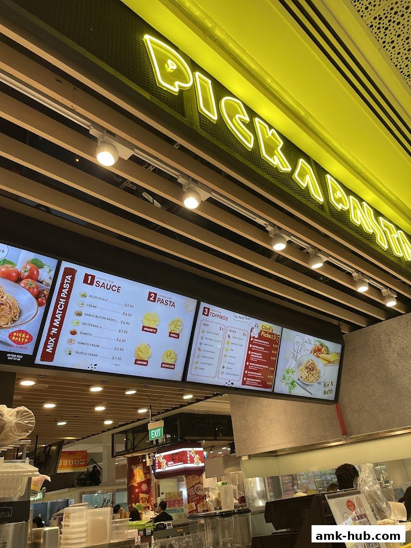 A digital menu board displaying pasta options, sauces, toppings, and chef's picks.