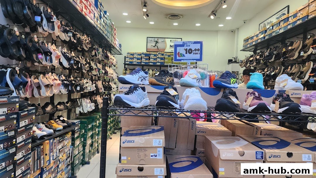 Interior view of a shoe store displaying a wide variety of athletic and casual footwear.