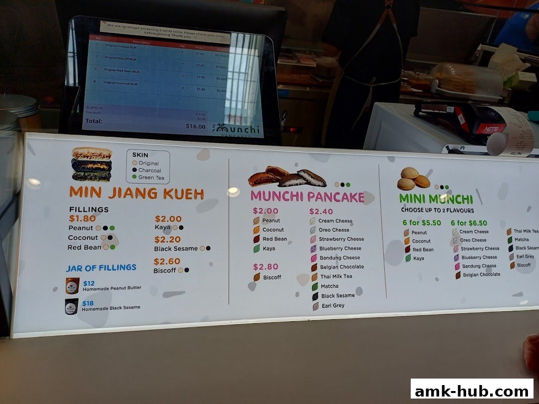 A menu board displaying various pancake and kueh options with prices and flavors.