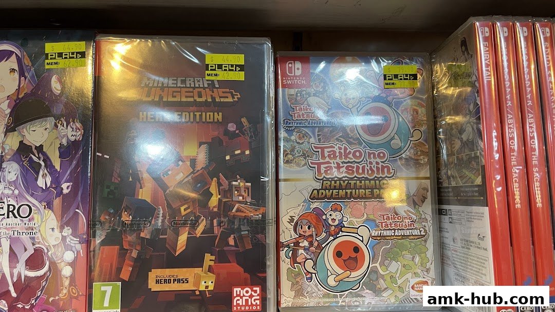 A shelf displaying various Nintendo Switch game cases, including Minecraft Dungeons and Taiko no Tatsujin.
