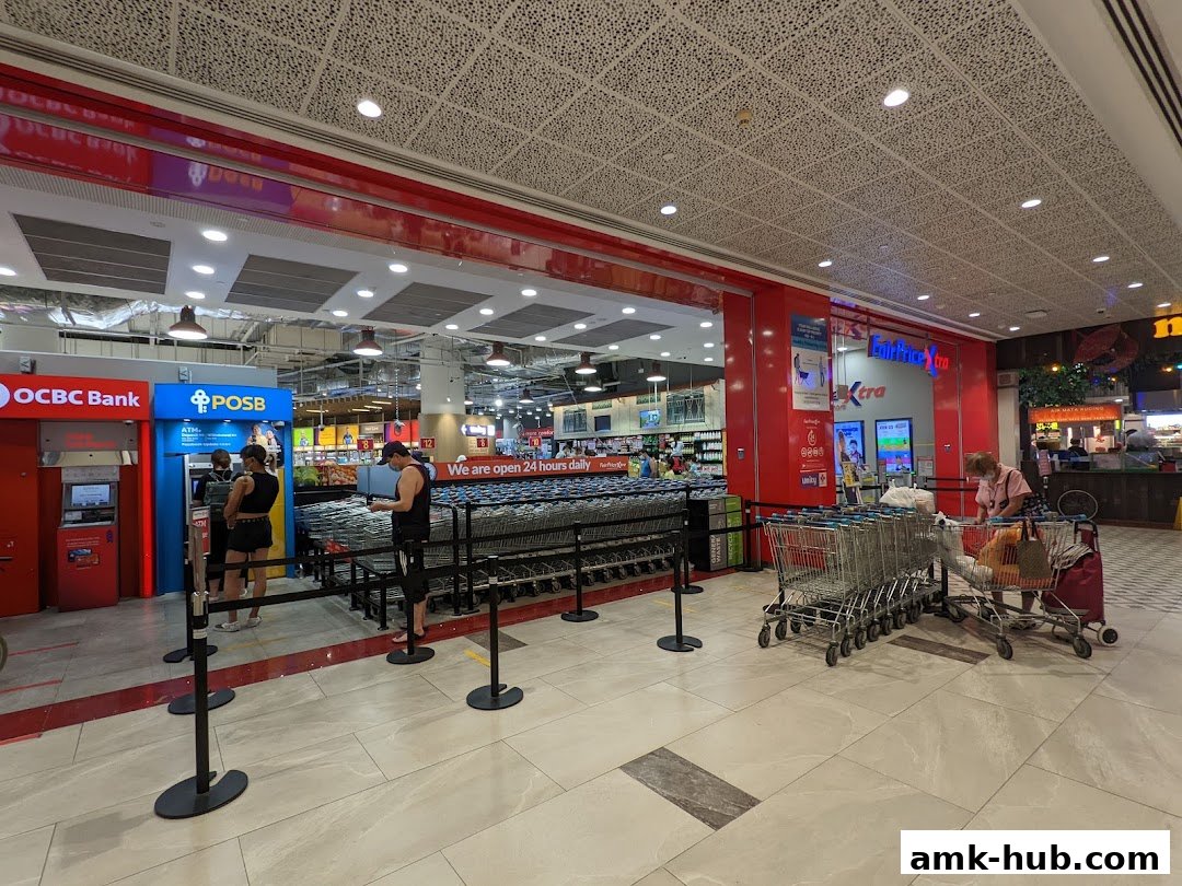 Entrance to a FairPrice Xtra supermarket with POSB ATM and OCBC Bank machines.