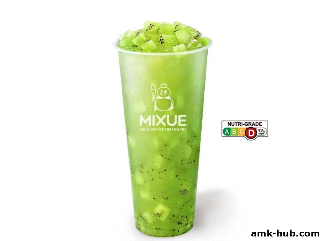 A tall cup of green kiwi slush with kiwi chunks and seeds, branded MIXUE.