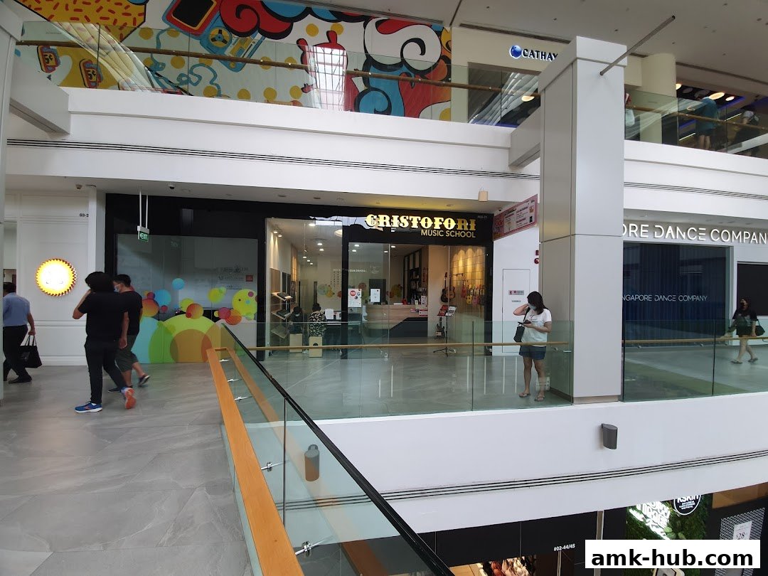 Cristofori Music School entrance with musical instruments displayed inside.
