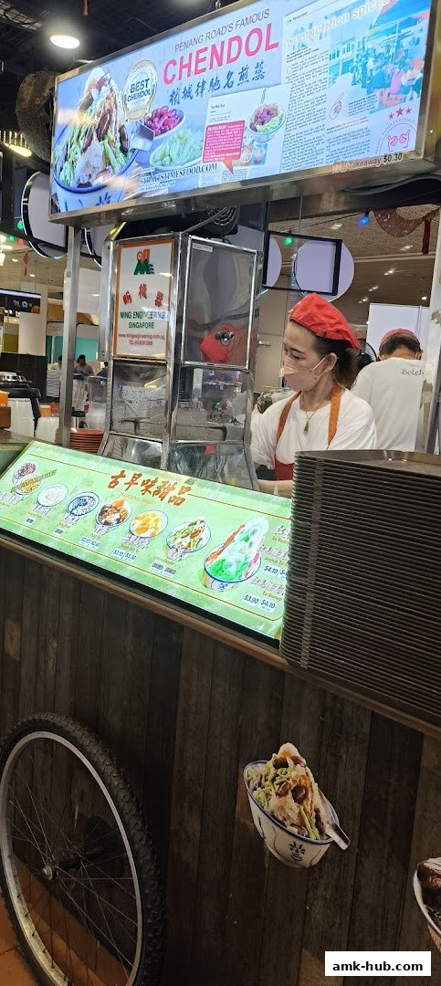A food stall displaying a menu of traditional desserts, featuring Chendol and other sweet treats.