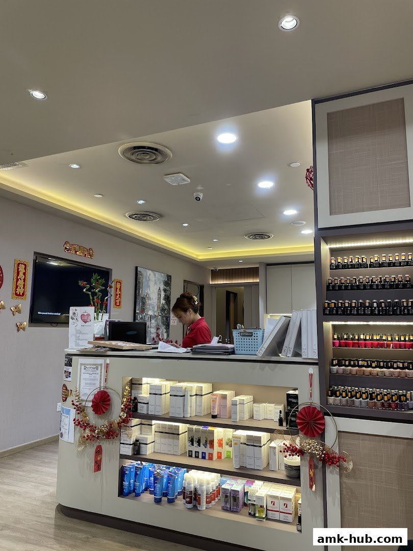 A woman works at the counter of a nail salon, with shelves of nail polish and beauty products.