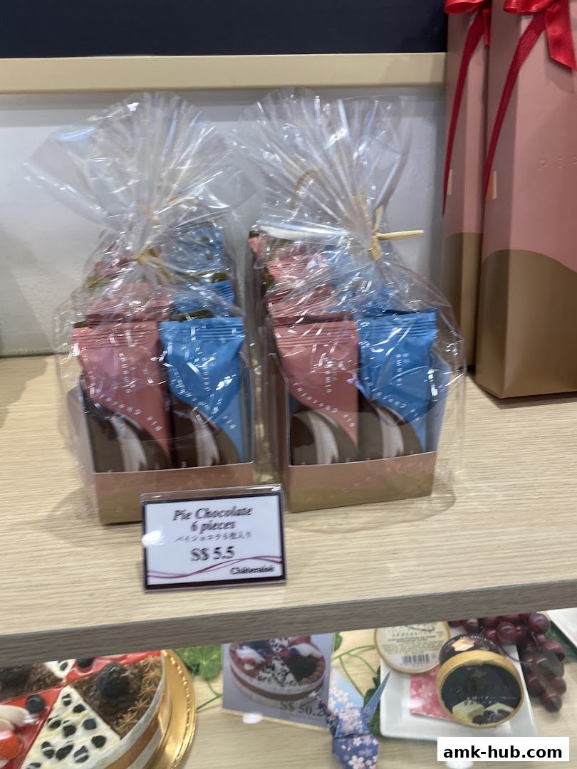 Packaged chocolate pies and cakes displayed on a shelf at Châteraisé.