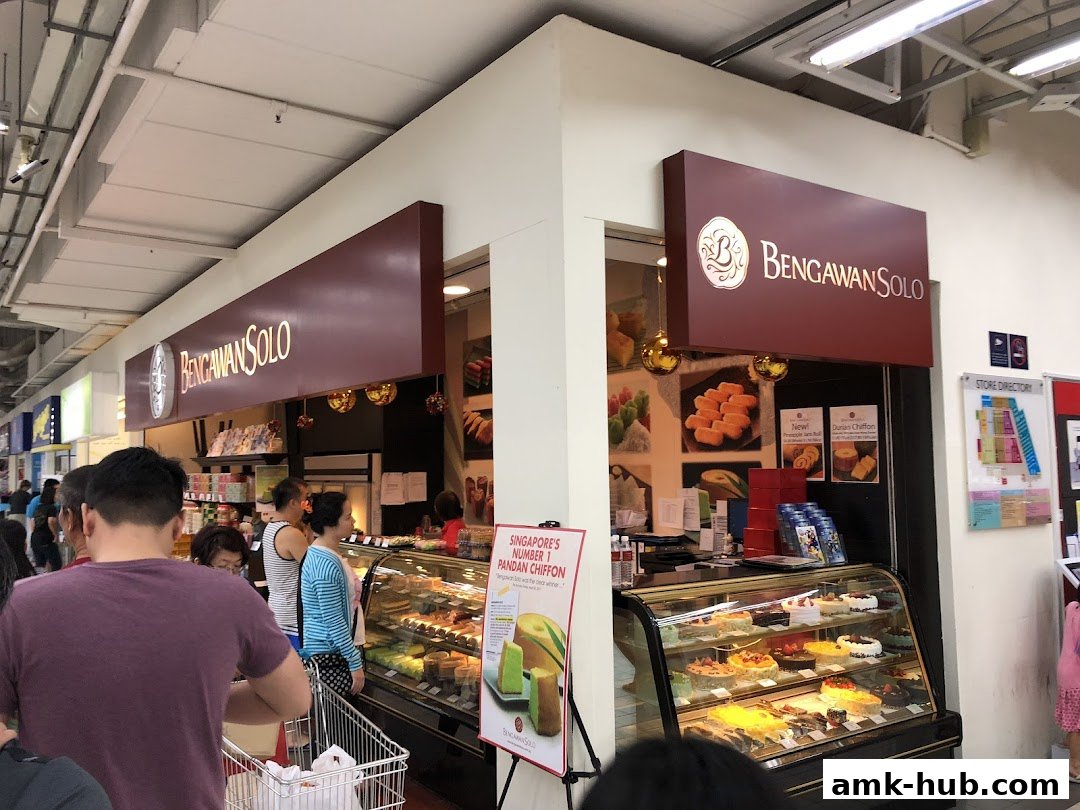 A Bengawan Solo shop displaying a variety of cakes and pastries in a display case.