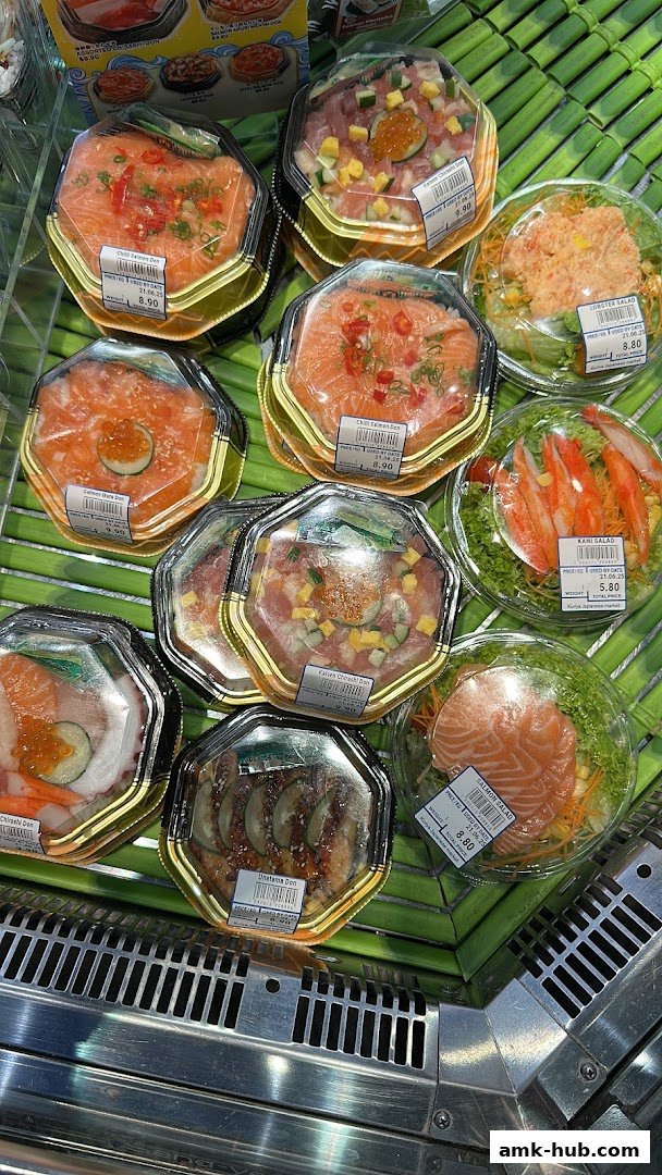A variety of pre-packaged Japanese seafood and rice bowls displayed in a refrigerated section.