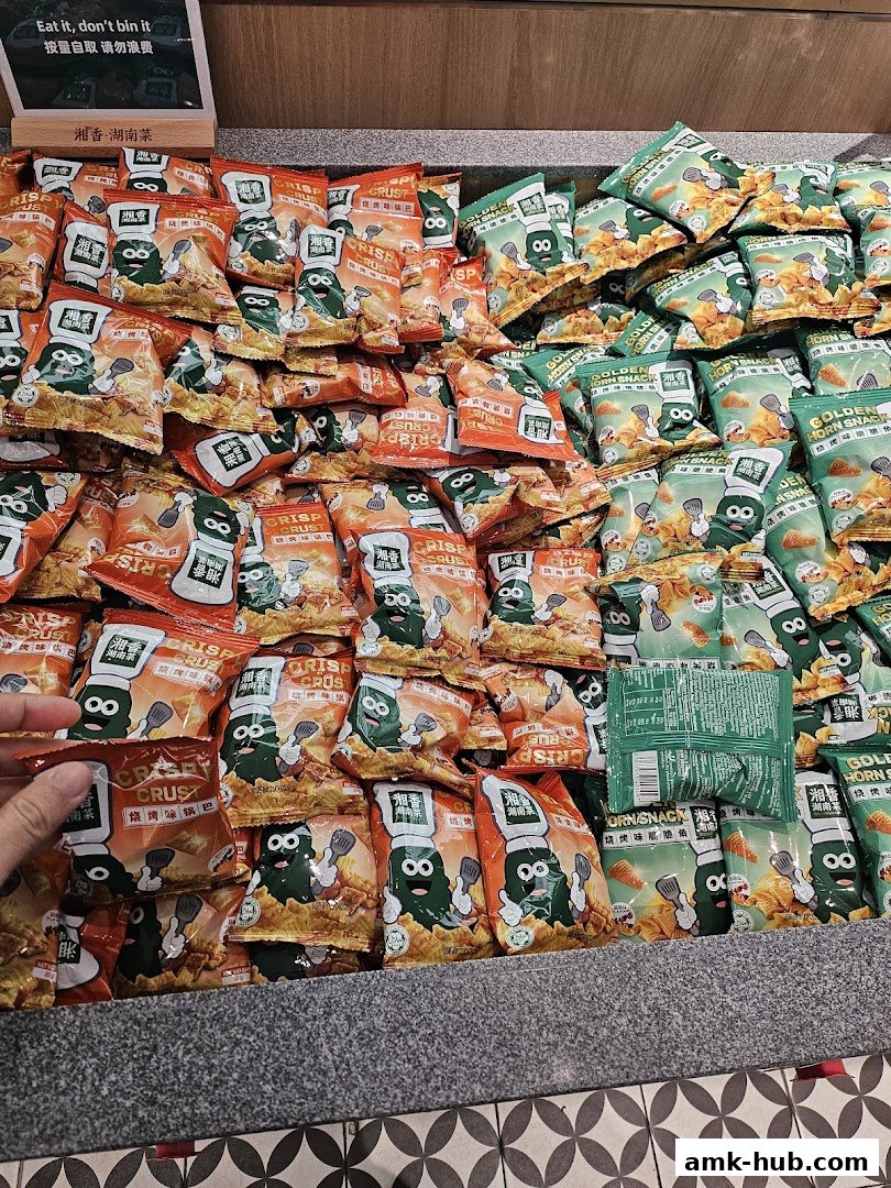 A display of various snack bags, featuring cartoon characters and Chinese text.