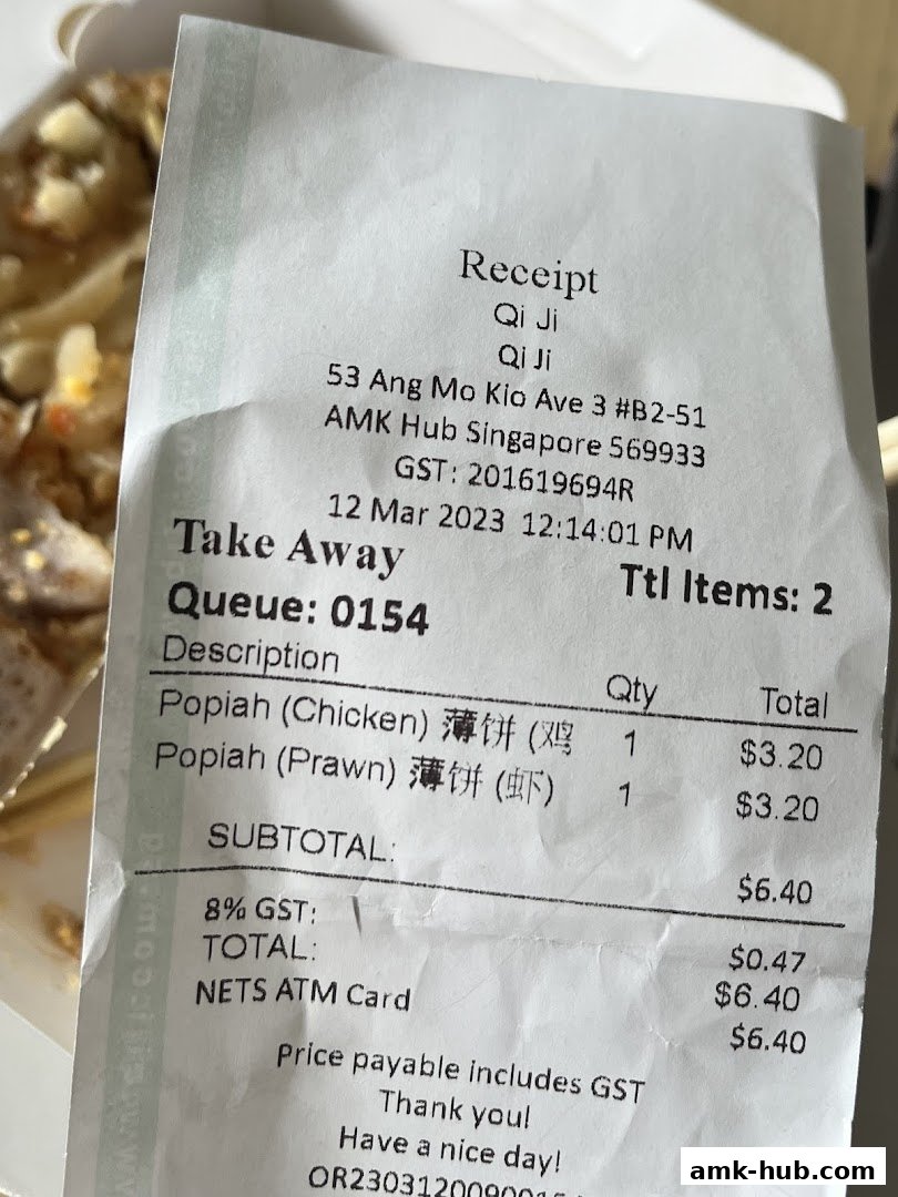 A receipt from Qi Ji showing a purchase of Popiah (Chicken) and Popiah (Prawn).