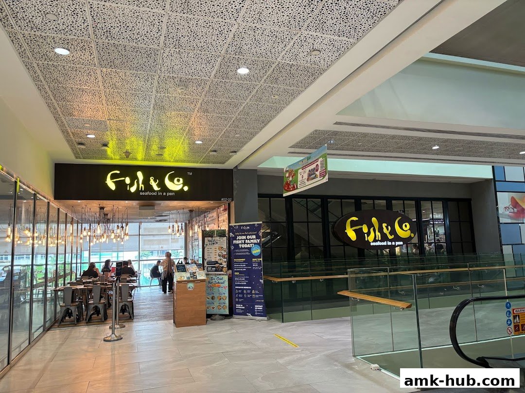 The exterior of Fish & Co. restaurant with its prominent signage and interior seating visible.