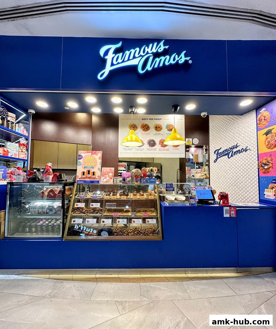 The Famous Amos shop front displays a variety of cookies and treats in display cases.