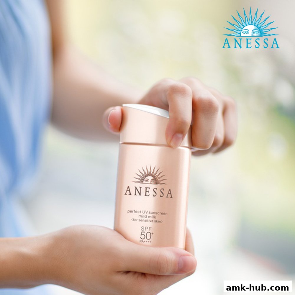 Hands holding a bottle of Anessa sunscreen with SPF 50.